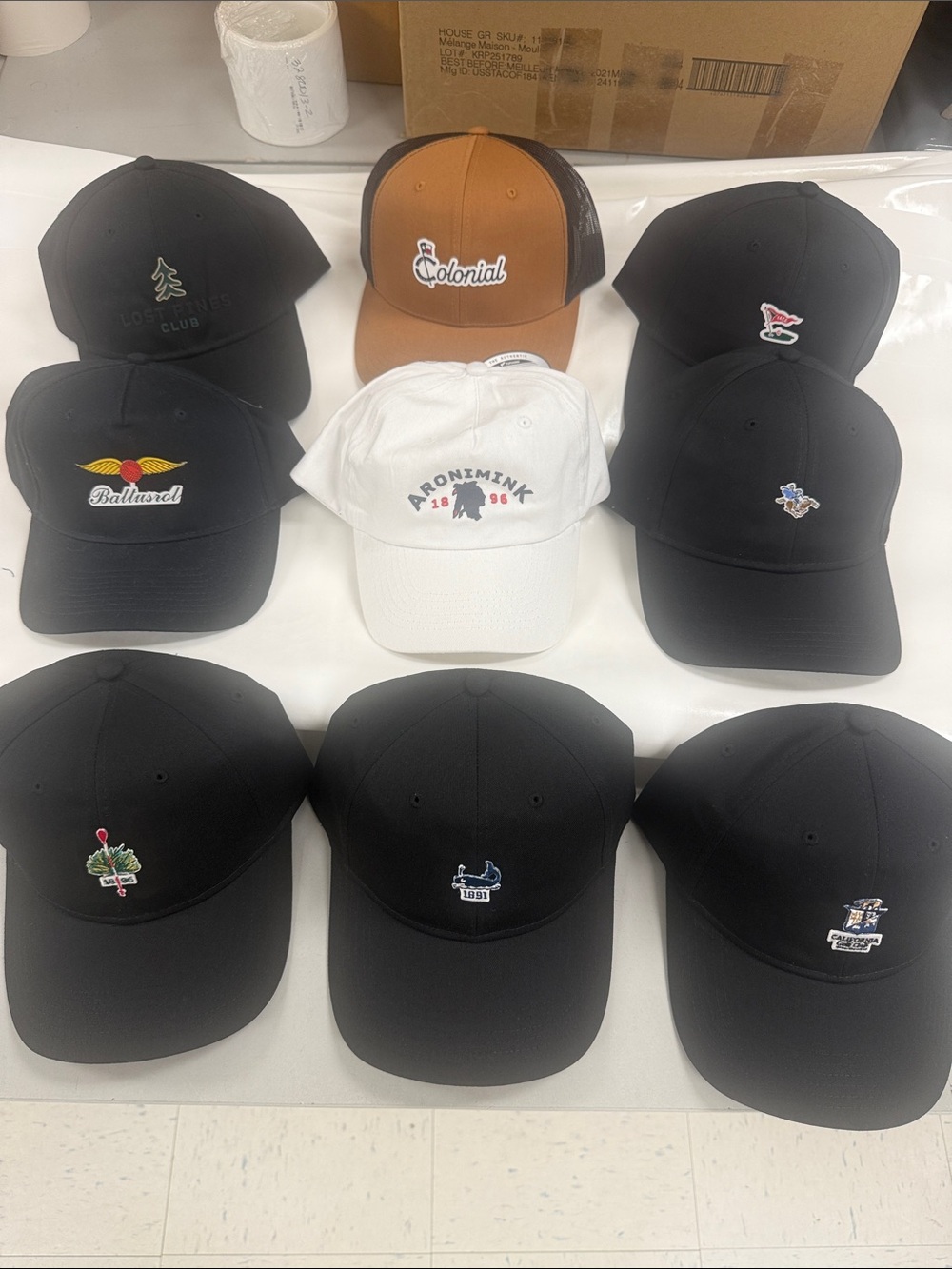 Lot of amazing golf courses sample hats- Black, White, Brown Options.
